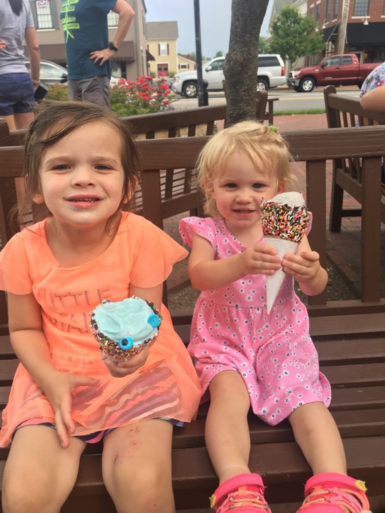 two little girls eating ice cream