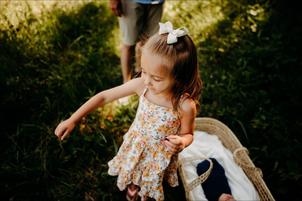 Little girl holding a bug