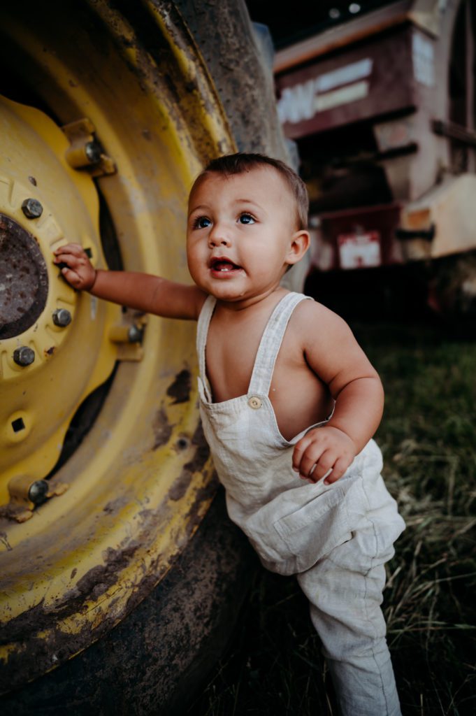 Little boy with a tractor tire. 