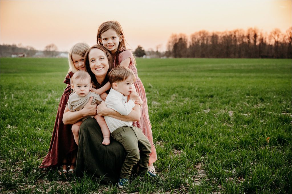 family in a field during spring outside Cincinnati, Ohio
