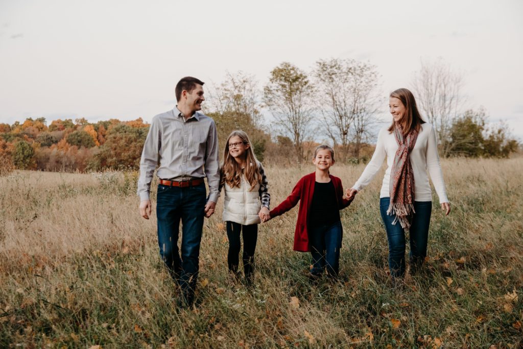 family in a field during fall outside Cincinnati, Ohio